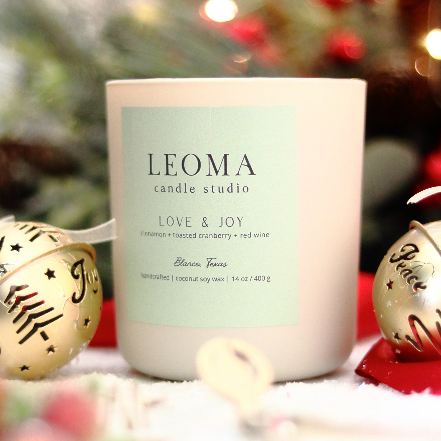 Handcrafted eco-friendly scented candle. Natural coconut & soy wax, toxin-free, 100% cotton wicks. Cream vessel. Love and Joy winter scent.