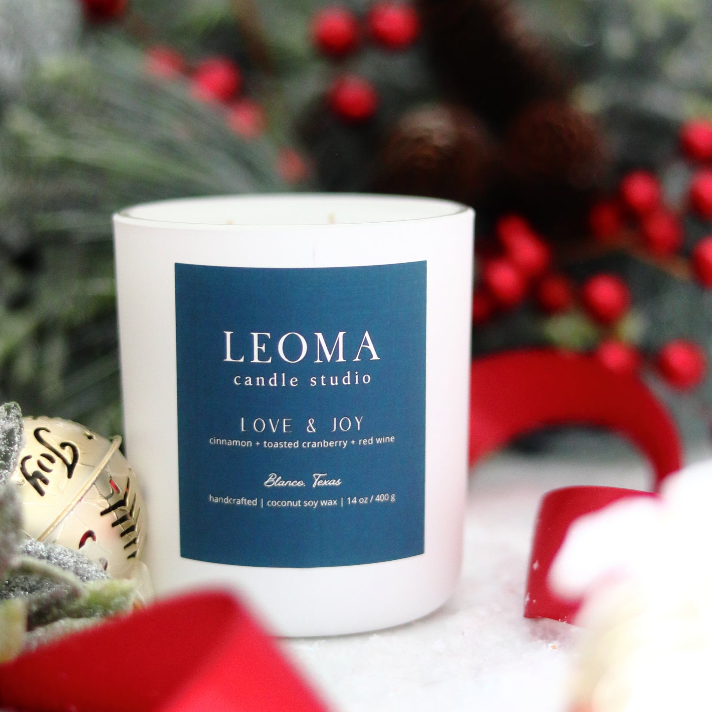 Handcrafted eco-friendly scented candle. Natural coconut & soy wax, toxin-free, 100% cotton wicks. White vessel. Love and Joy winter scent.