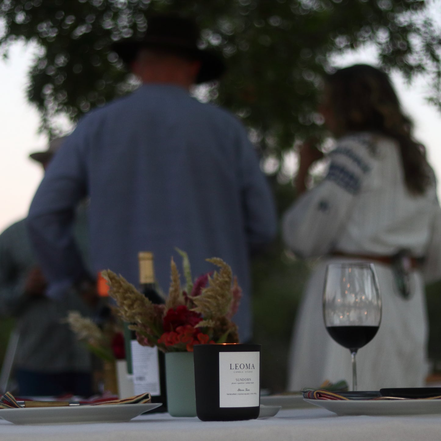 Sundown scented candle dinner table with wine