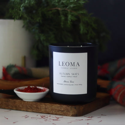 Scented natural soy candle. non toxic. Autumn Skies fall scent. Black vessel. Front zoom.