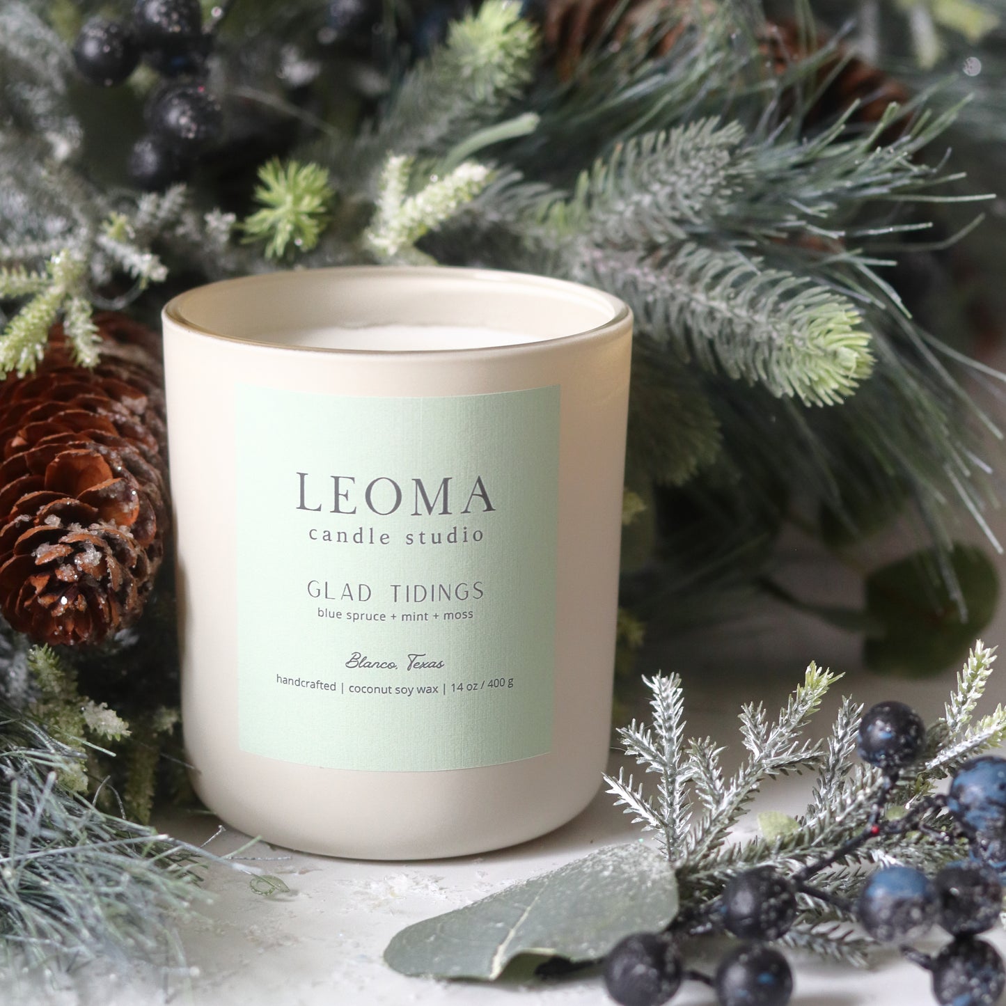 Handcrafted eco-friendly scented candle. Natural coconut & soy wax, toxin-free, 100% cotton wicks. cream vessel. Glad Tidings scented.