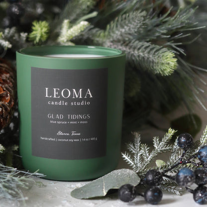 Handcrafted eco-friendly scented candle. Natural coconut & soy wax, toxin-free, 100% cotton wicks. Olive vessel. Glad Tidings scented.