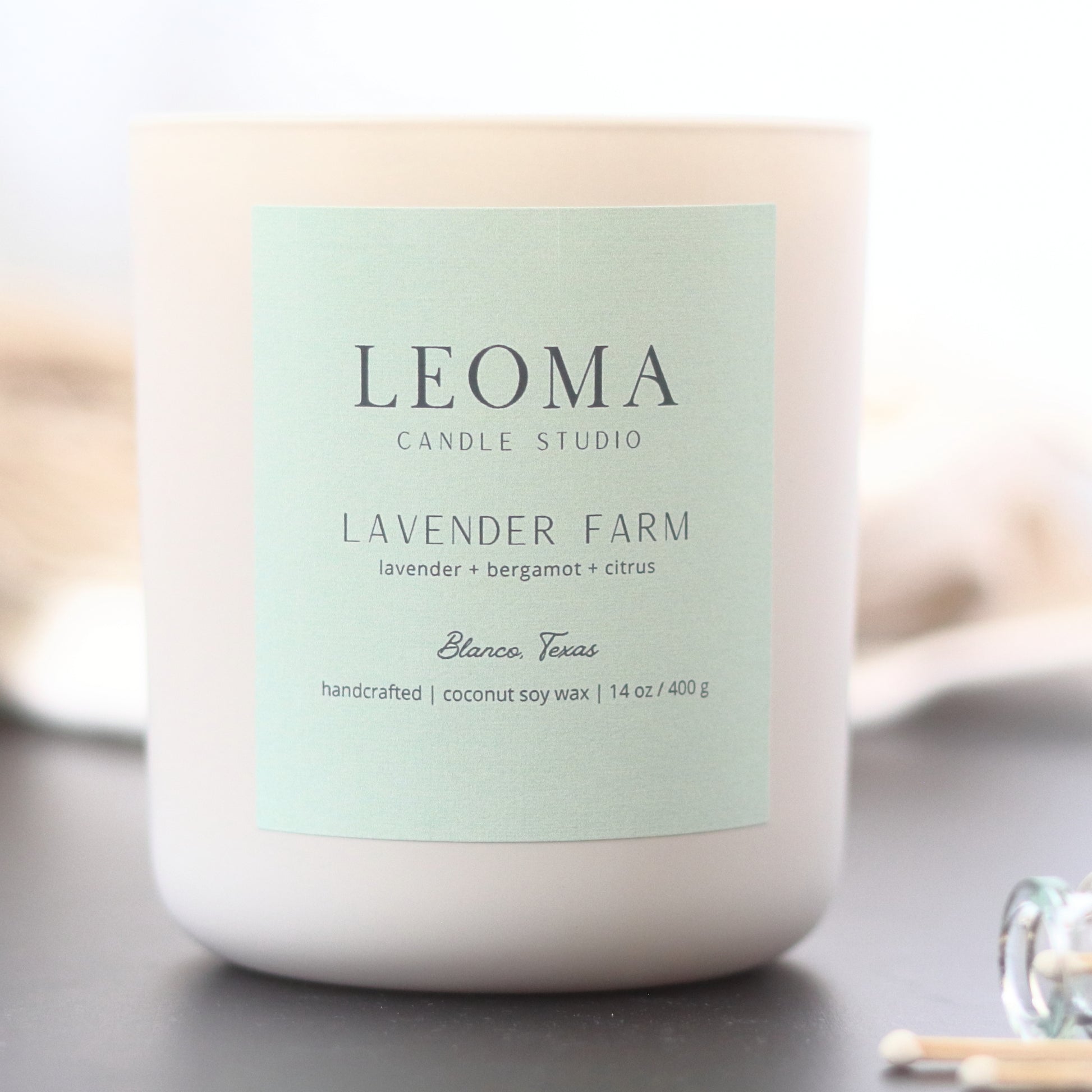 Handcrafted eco-friendly scented candle. Natural coconut & soy wax, toxin-free, 100% cotton wicks. Cream vessel. Lavender Farm classic scent.