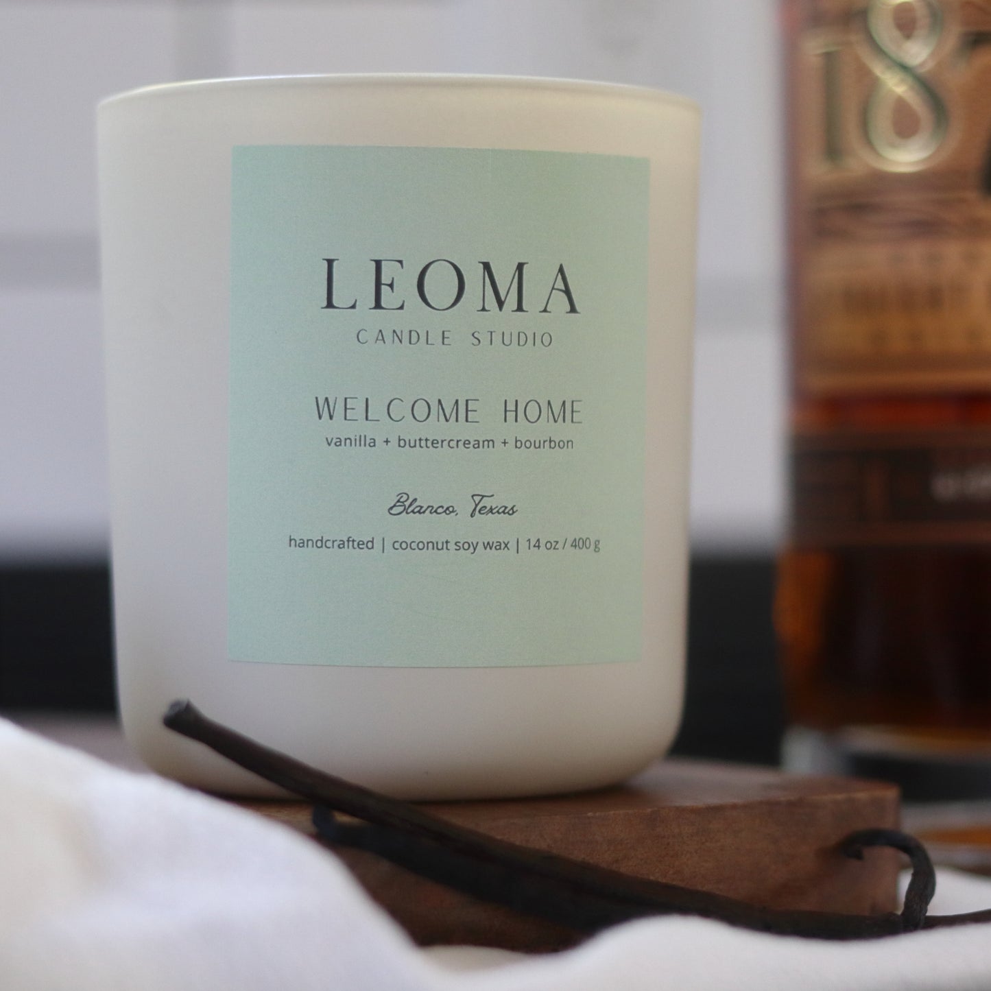 Handcrafted eco-friendly scented candle. Natural coconut & soy wax, toxin-free, 100% cotton wicks. Cream vessel. Welcome Home scented.