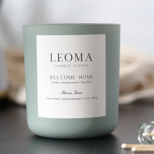 Handcrafted eco-friendly scented candle. Natural coconut & soy wax, toxin-free, 100% cotton wicks. Sage vessel. Welcome Home scented.