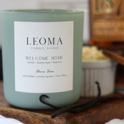 Handcrafted eco-friendly scented candle. Natural coconut & soy wax, toxin-free, 100% cotton wicks. Sage vessel. Welcome Home scented.