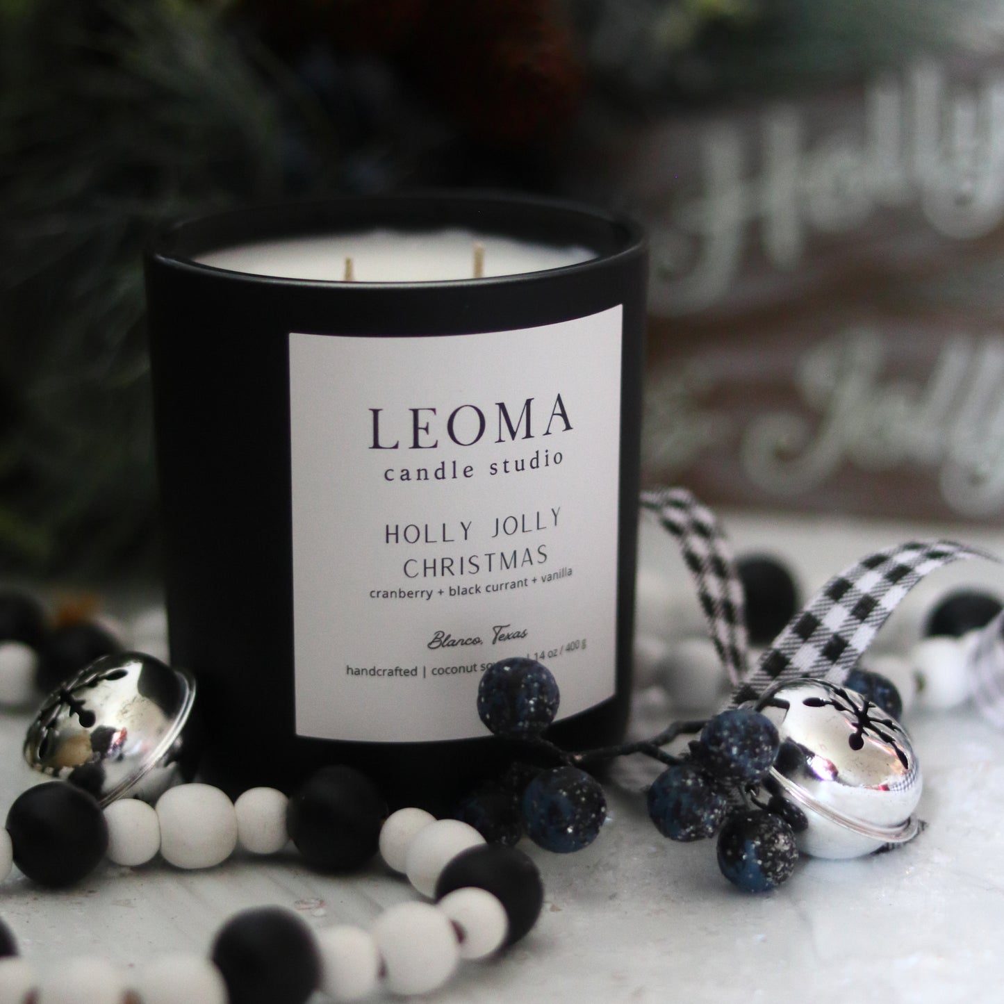 Handcrafted eco-friendly scented candle. Natural coconut & soy wax, toxin-free, 100% cotton wicks. Black vessel. Holly Jolly Christmas scented.