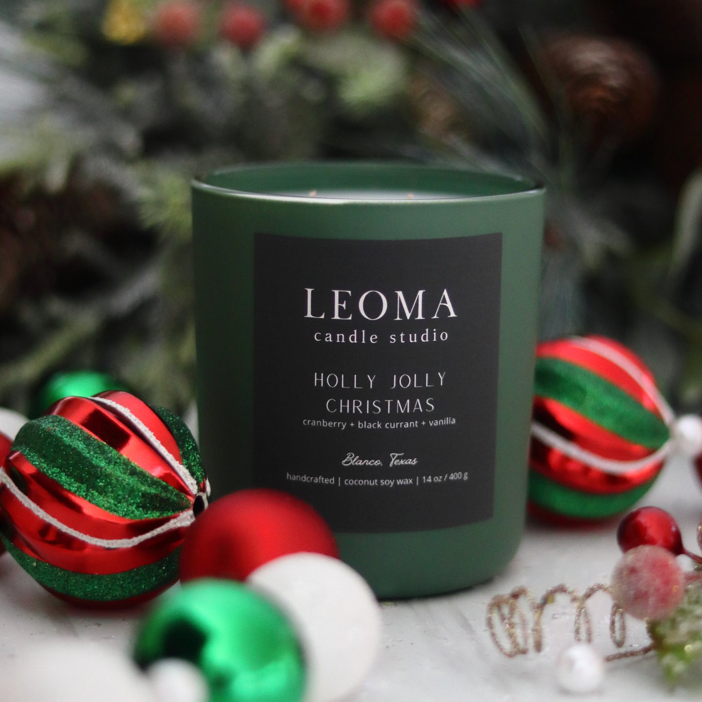 Handcrafted eco-friendly scented candle. Natural coconut & soy wax, toxin-free, 100% cotton wicks. Olive vessel. Holly Jolly Christmas scented.